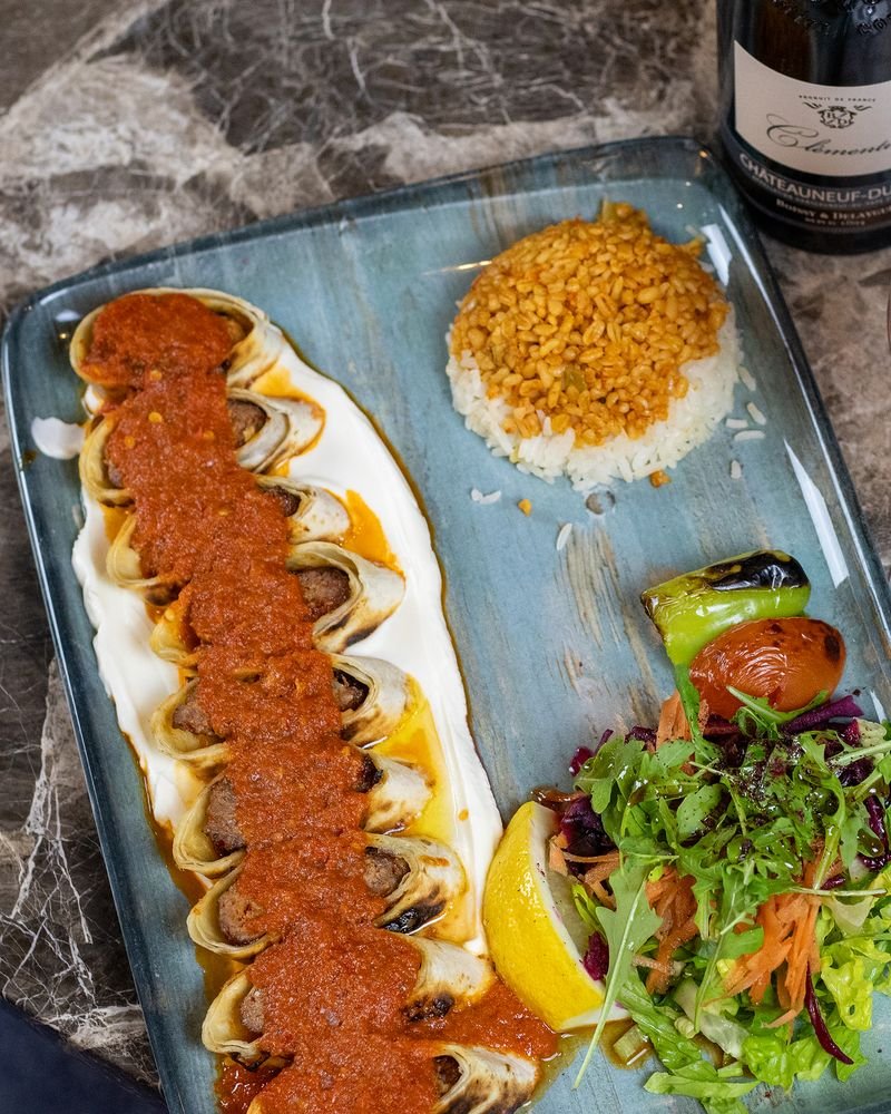 Sarma beyti wrapped in lavash bread with rice