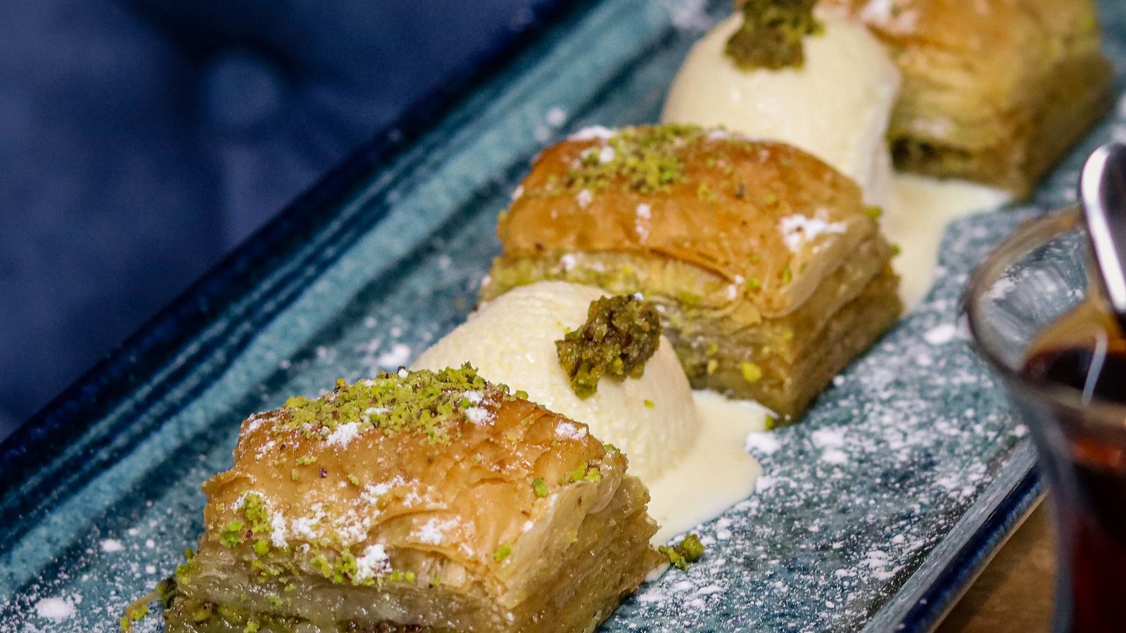 Pistachio baklava with clotted cream and a glass of Turkish tea